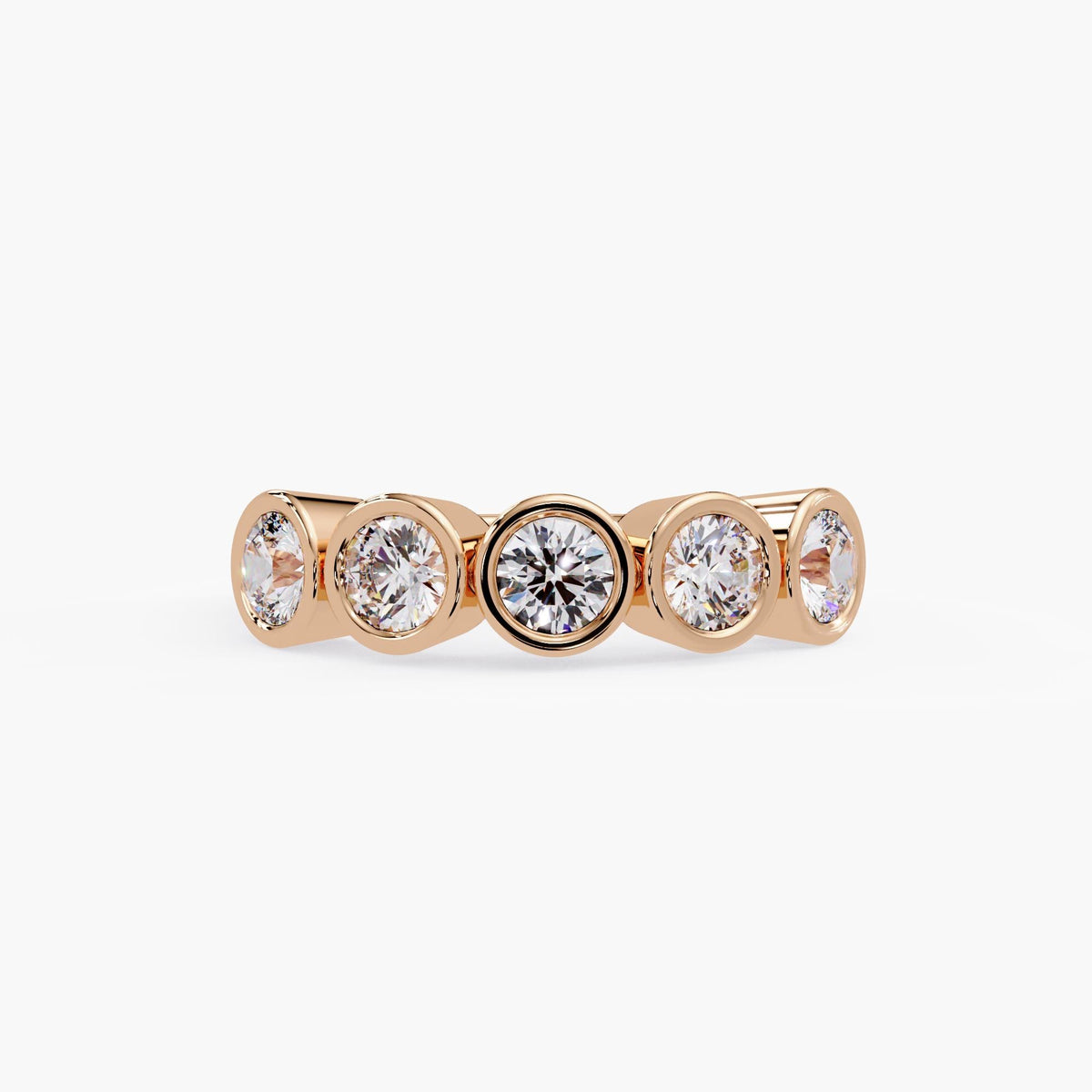 Bezel set five-stone diamond band in rose gold.