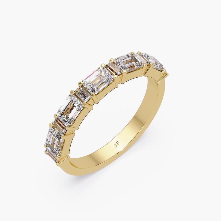 Close-up of prong-set emerald and baguette cut lab diamonds in 14K gold band, showcasing clarity and clean layout for bridal stack or minimalist engagement alternative.