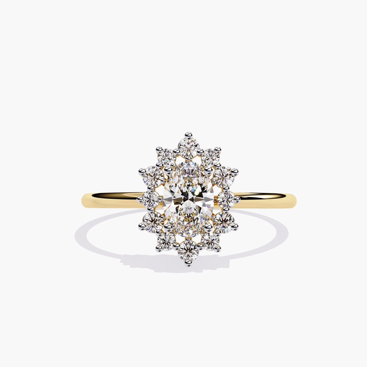 A yellow gold ring featuring a 0.5 carat oval lab-grown diamond at the center, surrounded by a floral-style halo of small round diamonds. The ring has a thin 1.3mm polished band and a starburst or sunburst arrangement.