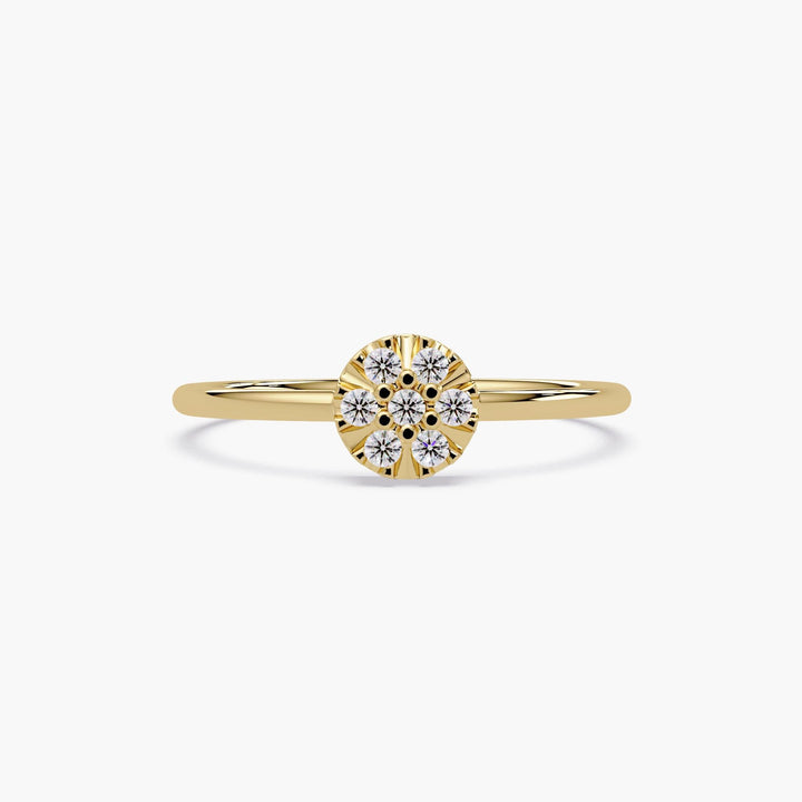 Close-up of a dainty 14k gold flower diamond ring with nine natural diamonds.