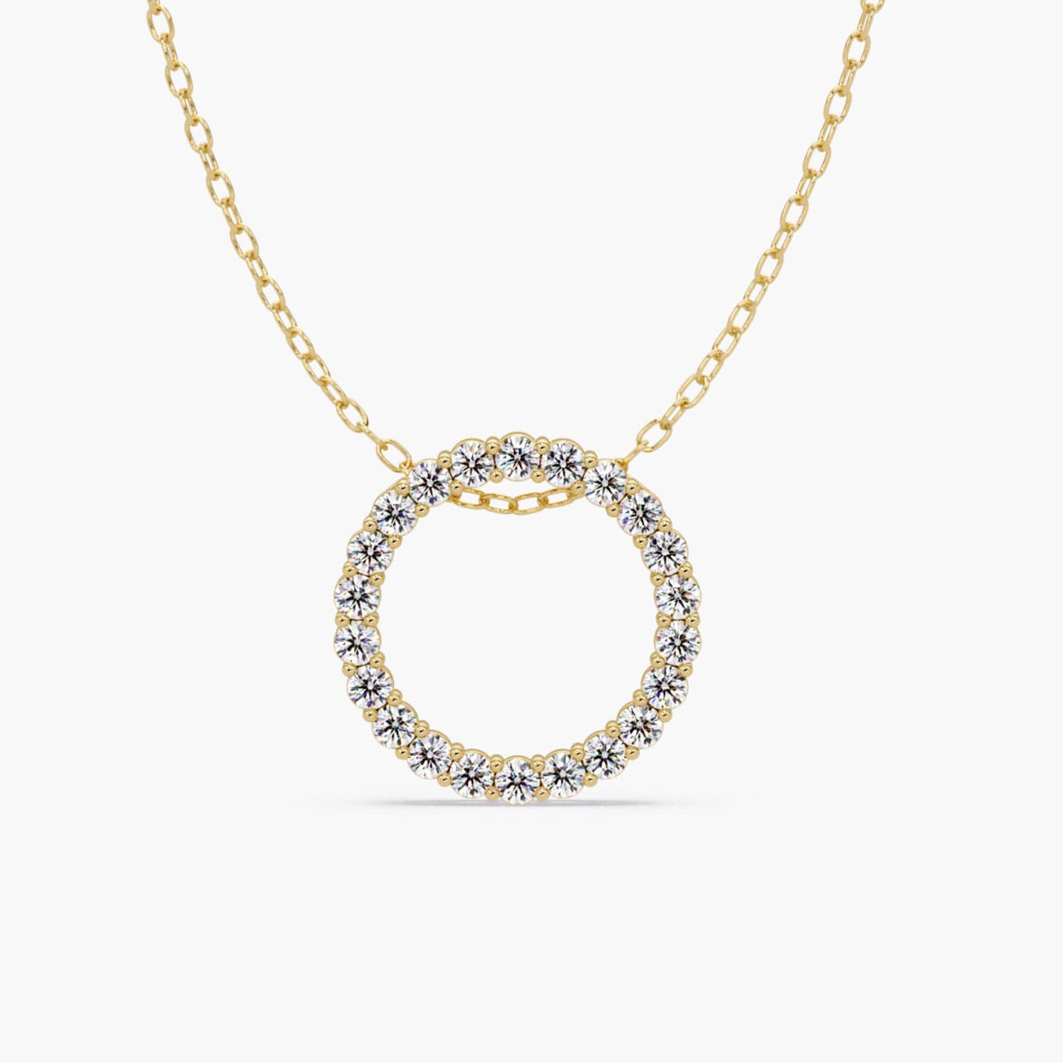 14k gold open circle diamond pendant featuring natural round diamonds set in a full eternity design. A large solid gold round pendant on a delicate chain.