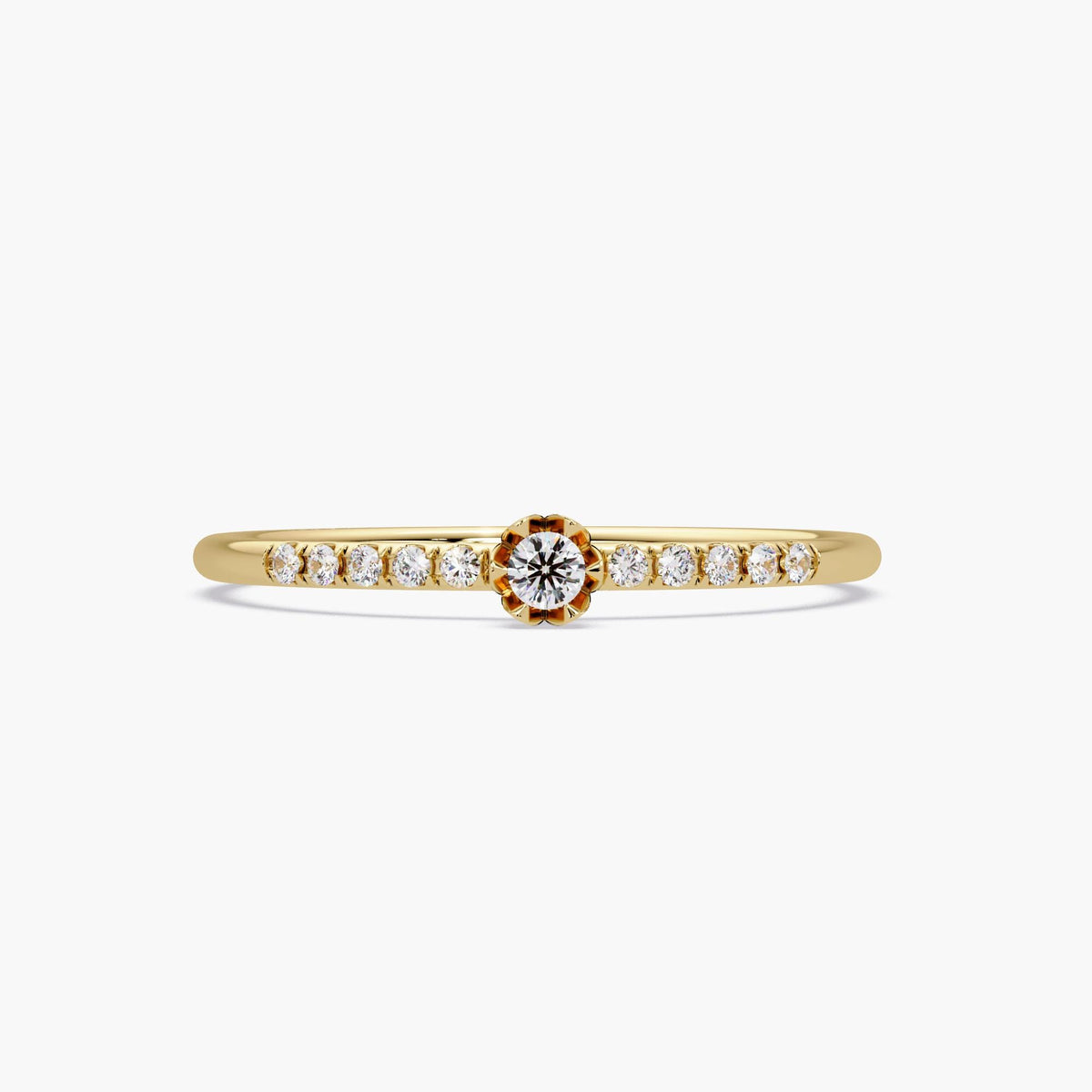 14k gold dainty diamond pave band photographed close-up in studio lighting