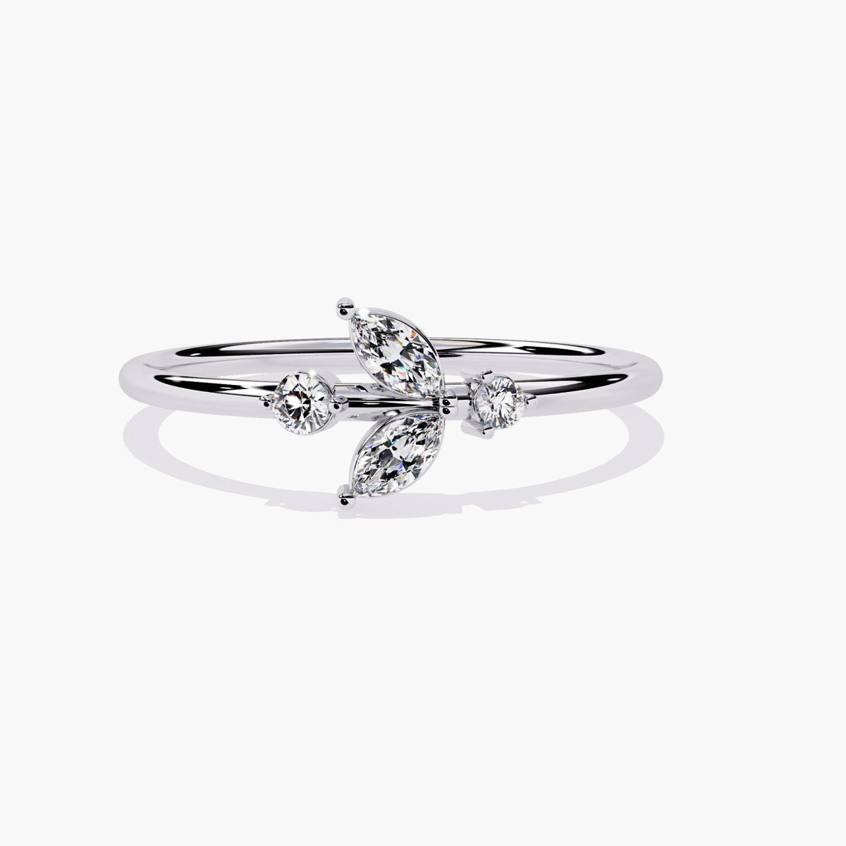 A white gold ring with a delicate leaf design featuring marquise-shaped diamonds and two round diamonds.