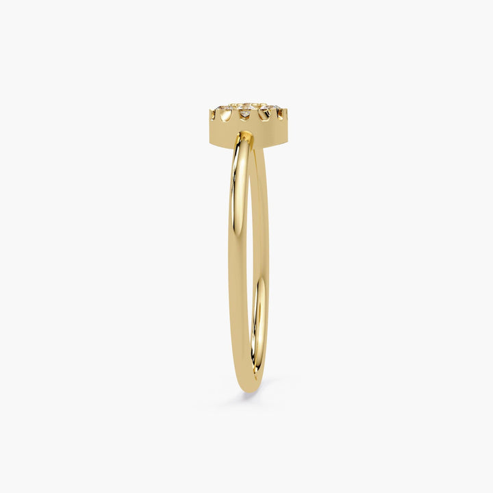 Side profile of a dainty gold ring with slim 1.3mm band and prong setting.