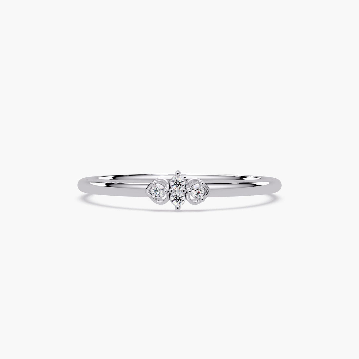Minimalist gold heart diamond ring photographed on a white background.
