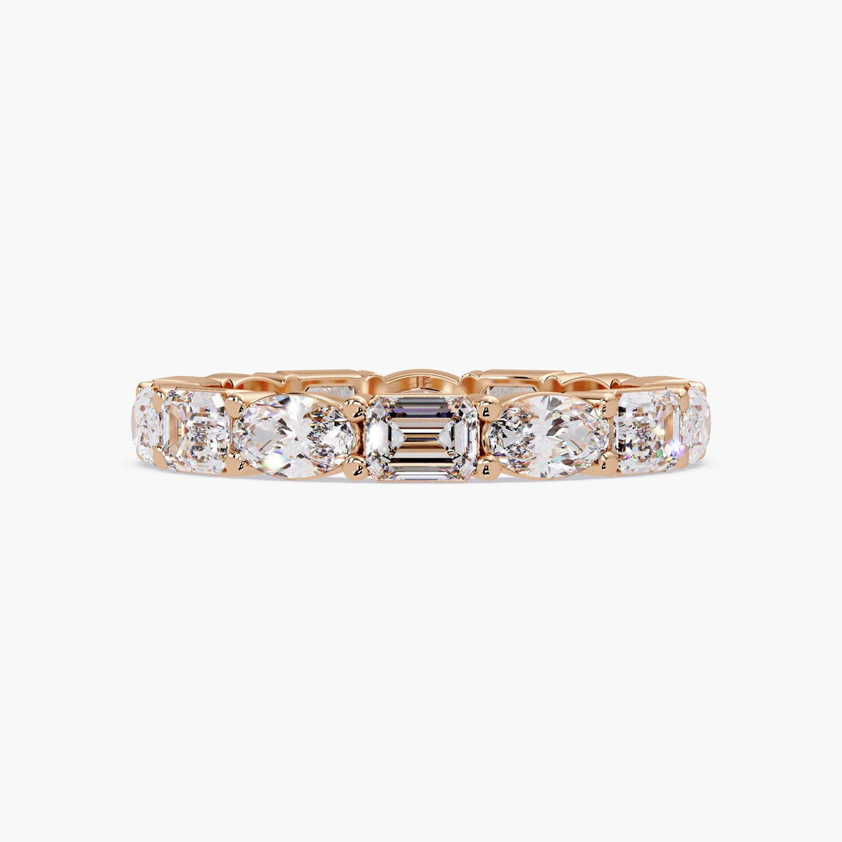 Lab grown oval and emerald cut diamond wedding ring.