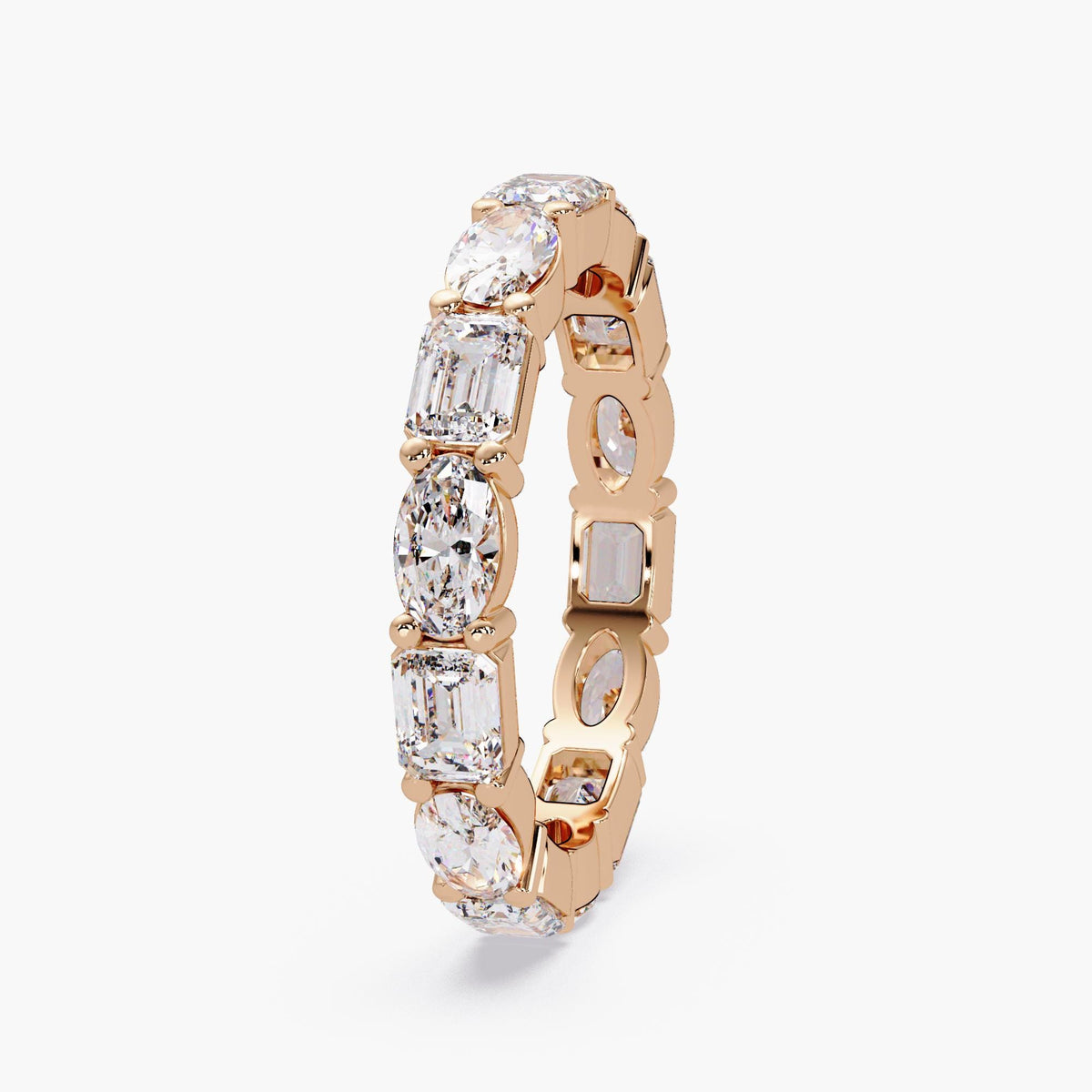 Stacking eternity band with oval and emerald cut diamonds.
