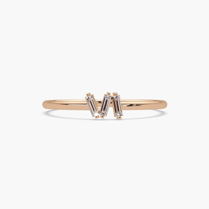 Dainty three stone baguette diamond stacking ring in solid rose gold.