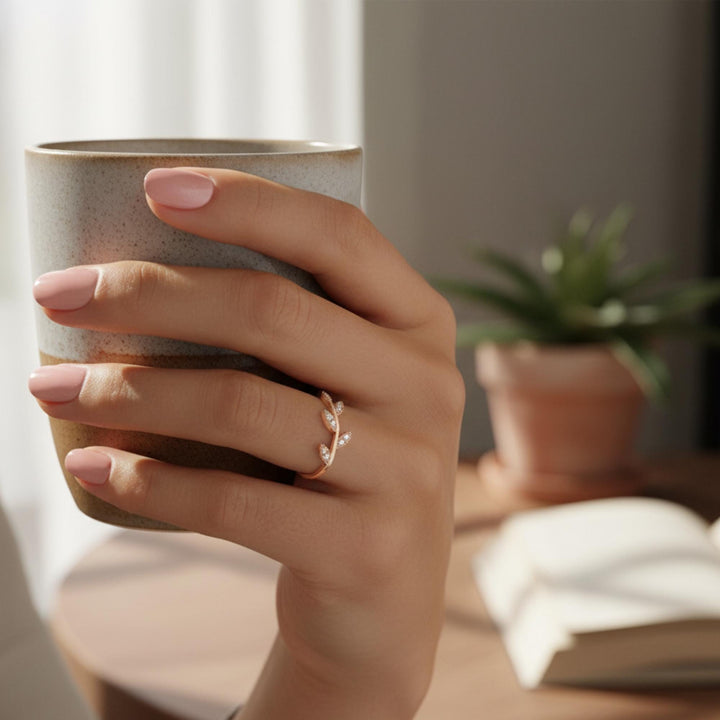 Fine jewelry gold ring with diamond leaf details and delicate band