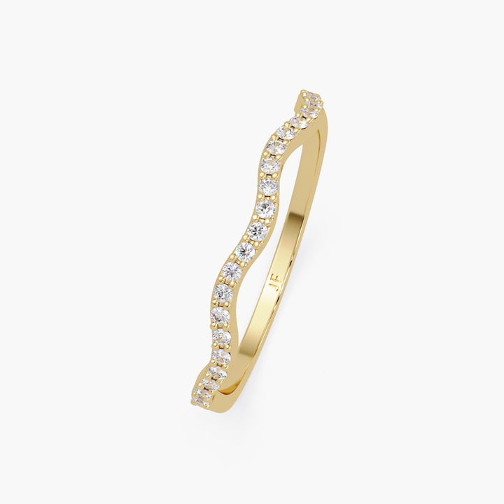 Pave set diamond curved wedding ring in 14k yellow gold