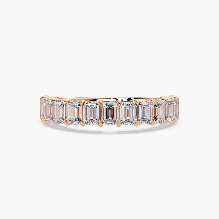 Emerald cut diamond eternity band ring in 14K gold.