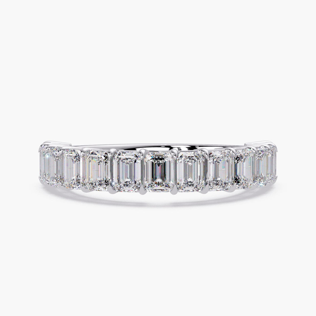 Emerald cut diamond eternity band ring in 14K white gold.