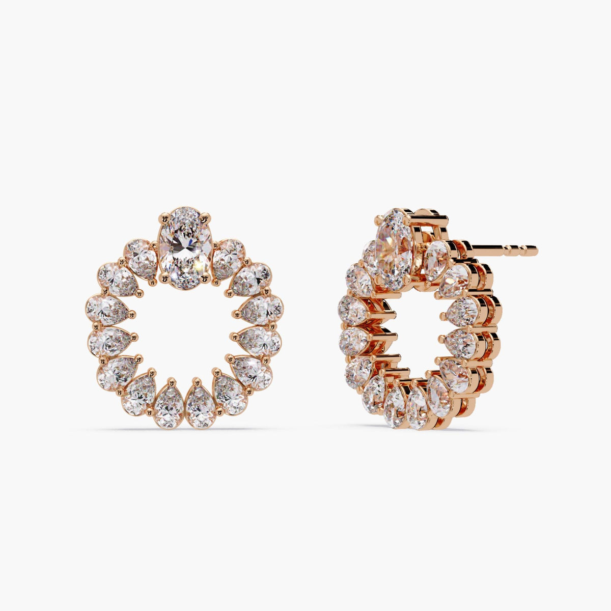 Oval and pear diamonds forming a circular hoop design.
