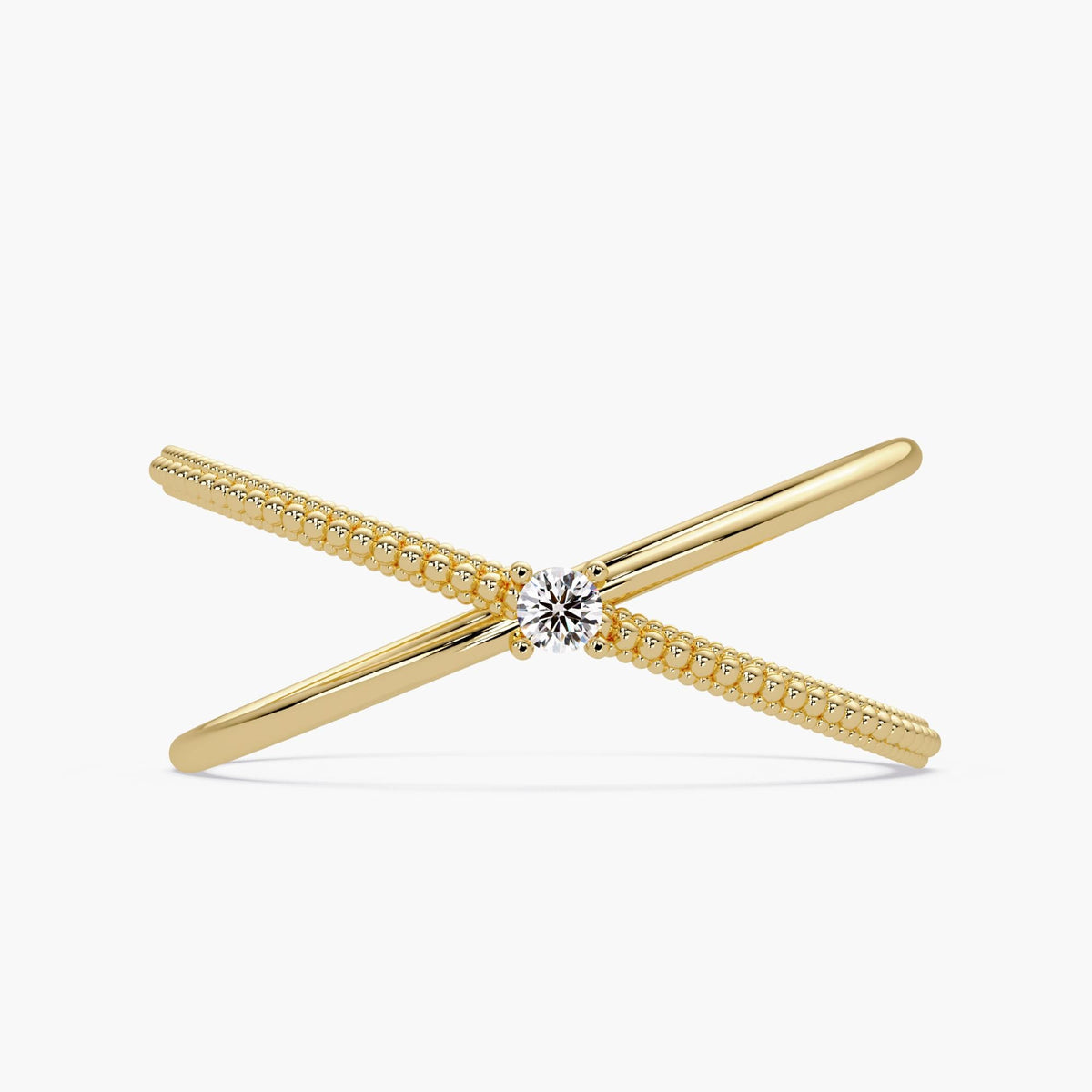 14k solid gold criss cross ring featuring a round natural diamond at the center, with one polished band crossing over a beaded gold band in an X-ring design.