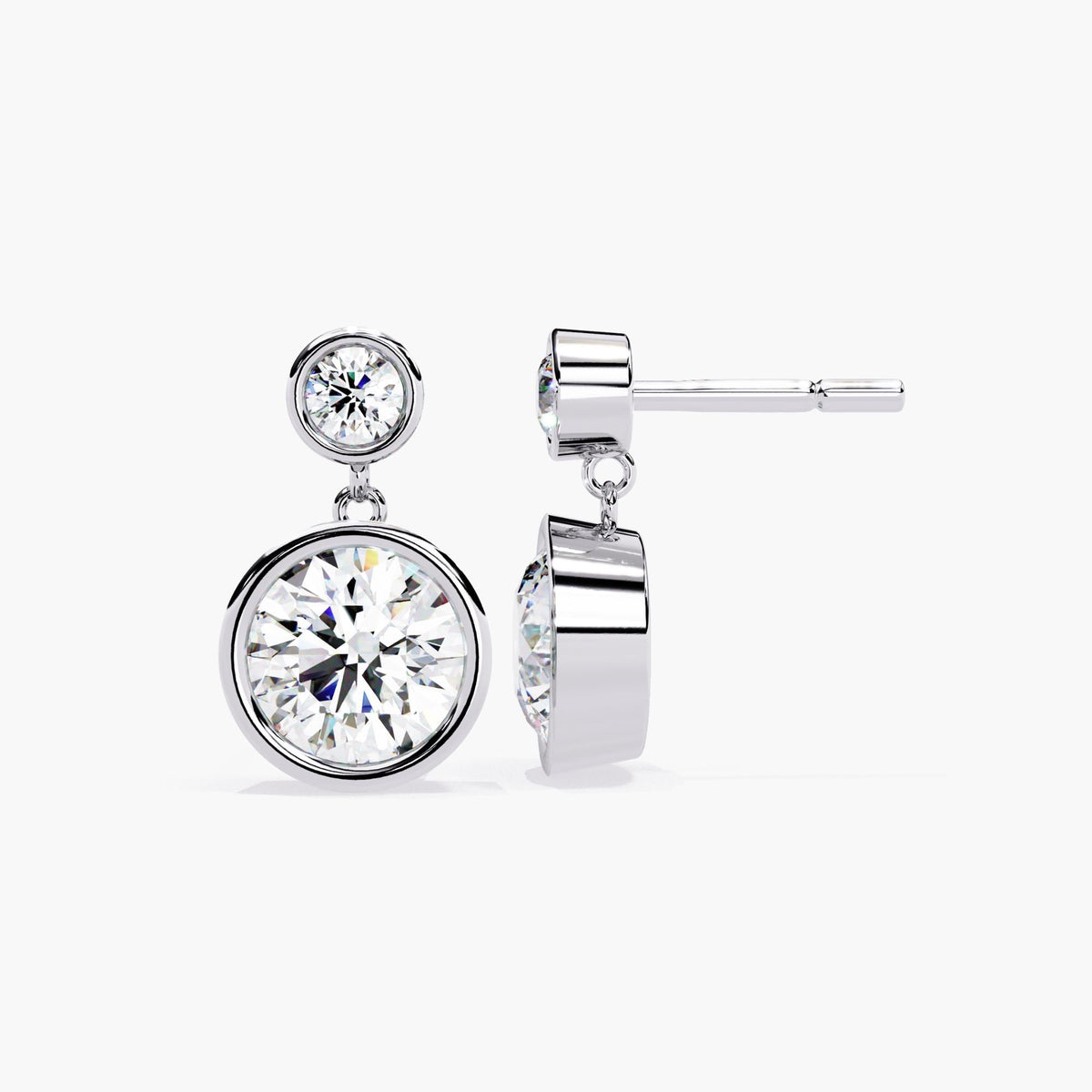 Front and side view of 14k white gold dangle earrings with bezel-set round lab grown diamonds. The minimalist drop design features two circular round diamonds per earring, perfect as modern bridal earrings, wedding jewelry, or a gift for her.