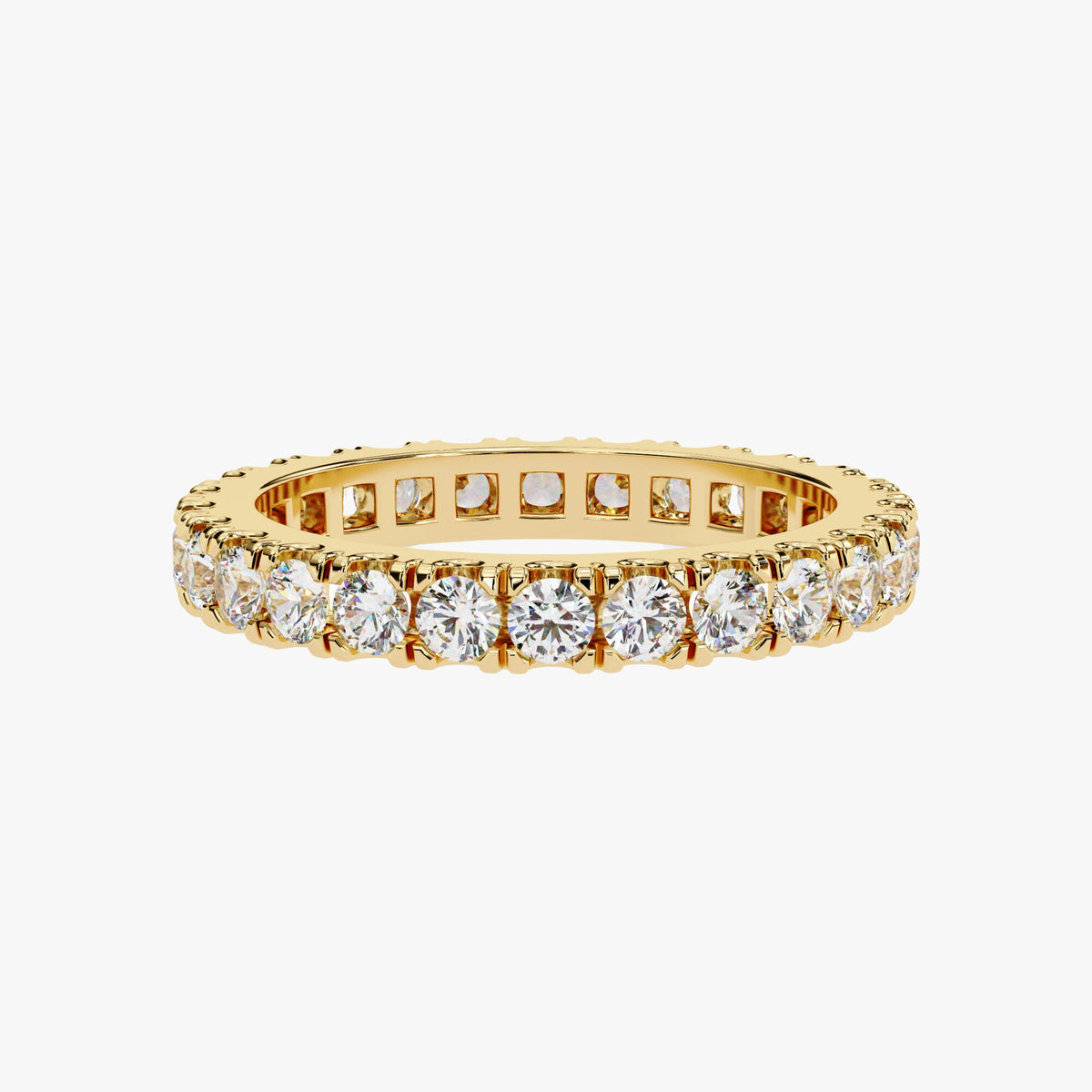 May include: A gold band with a row of round, clear diamonds set into the band.