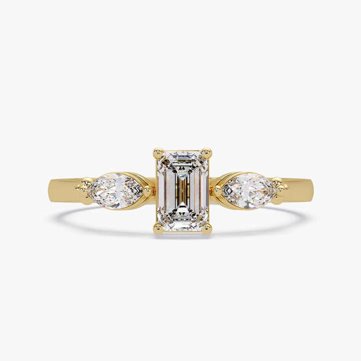 lab grown diamond three stone ring in yellow gold band