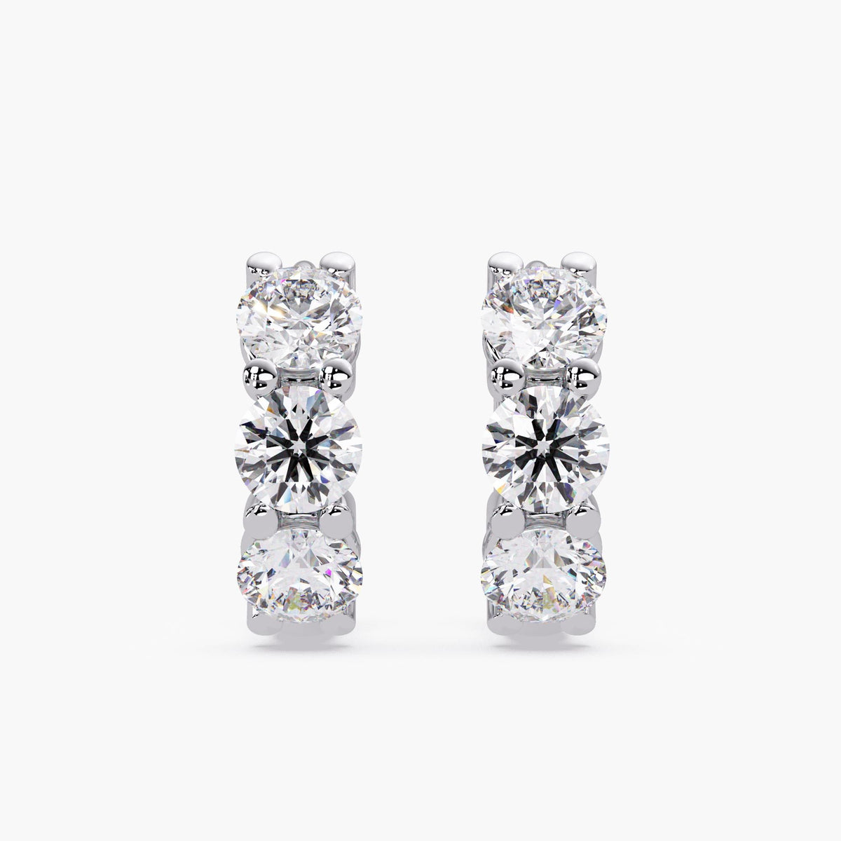 close up of lab grown diamond hoops in white gold setting