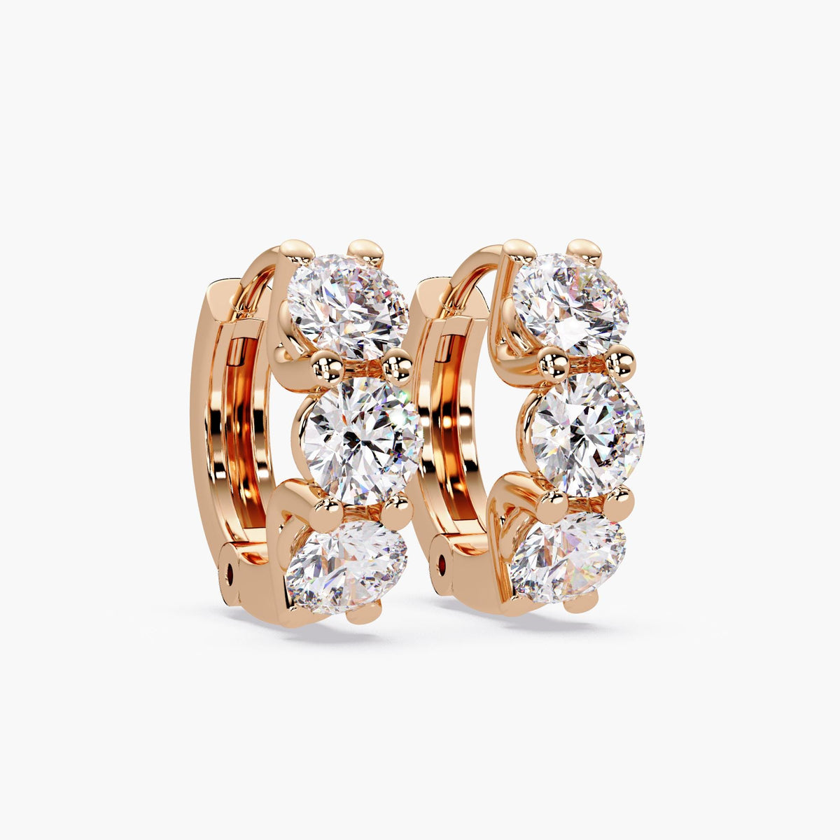 fine jewelry diamond earrings displayed on white background