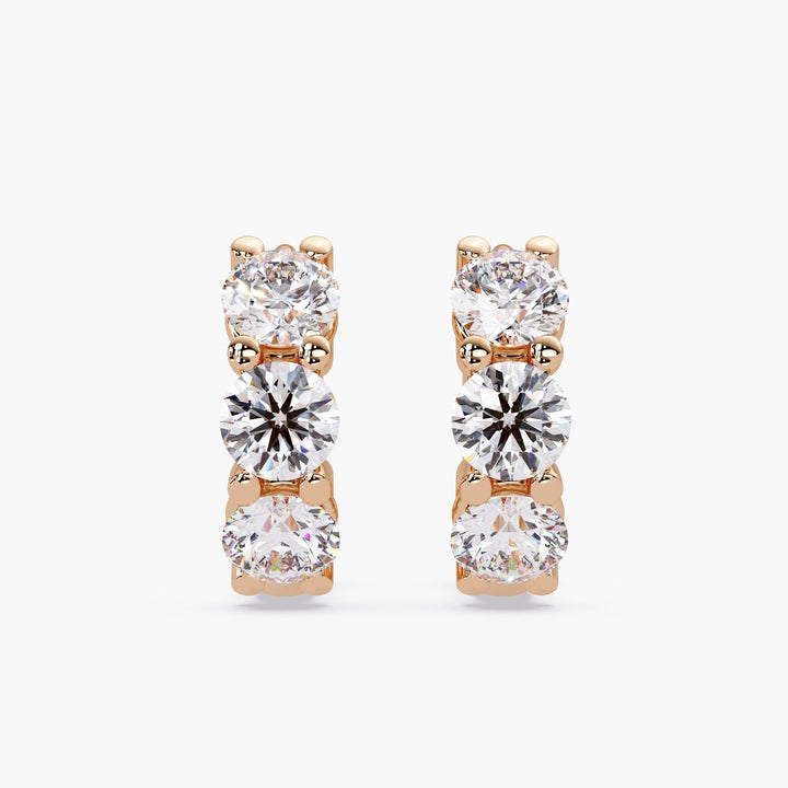 14k rose gold diamond hoop earrings with three round diamonds each side