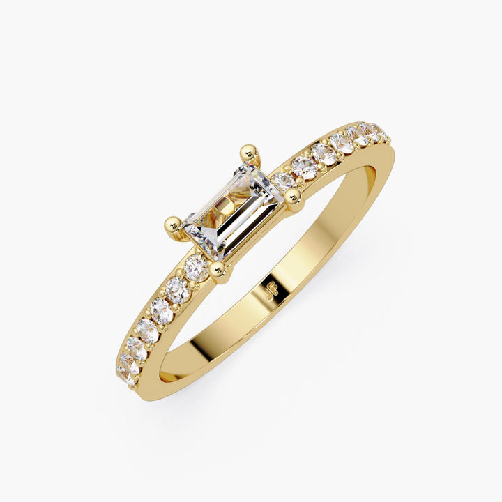 14K yellow gold baguette diamond ring with 0.40 CTW lab-grown center stone in an east-west solitaire setting and petite pave band