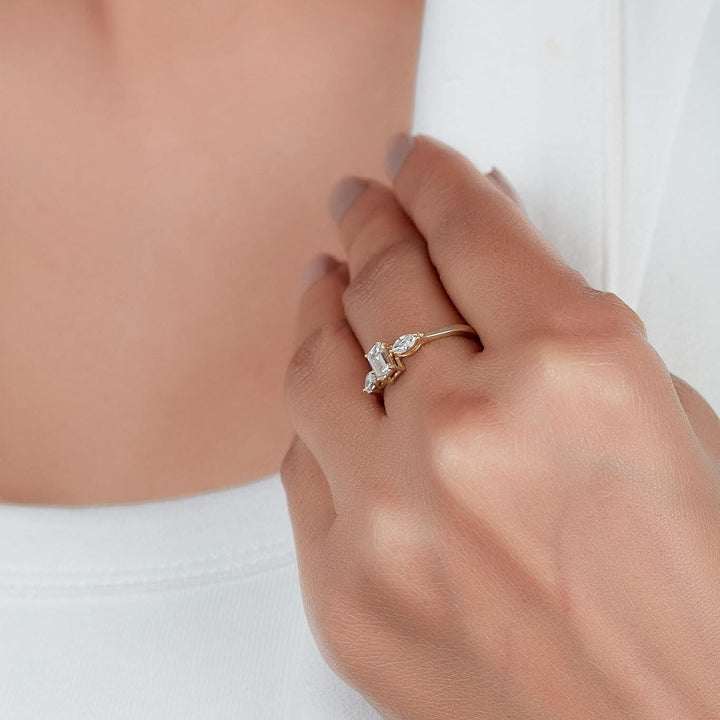 14k yellow gold emerald cut and pear diamond ring