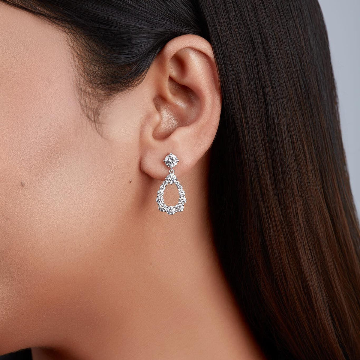 Sterling silver teardrop diamond earrings with brilliant round-cut stones