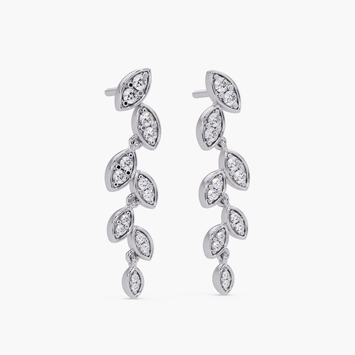 Long diamond dangle earrings that move gracefully to enhance effortless glamour.
