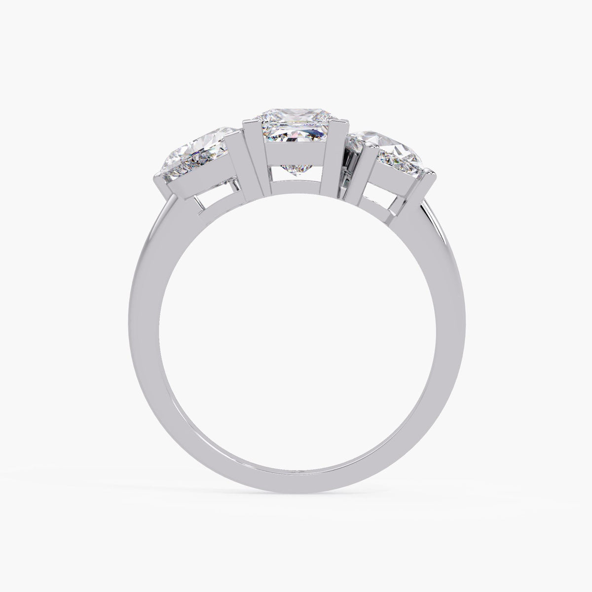 14K white three-stone lab diamond ring showing prong setting and polished band detail