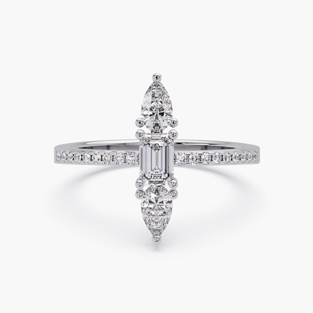 White gold version of vertical emerald and pear lab diamond ring