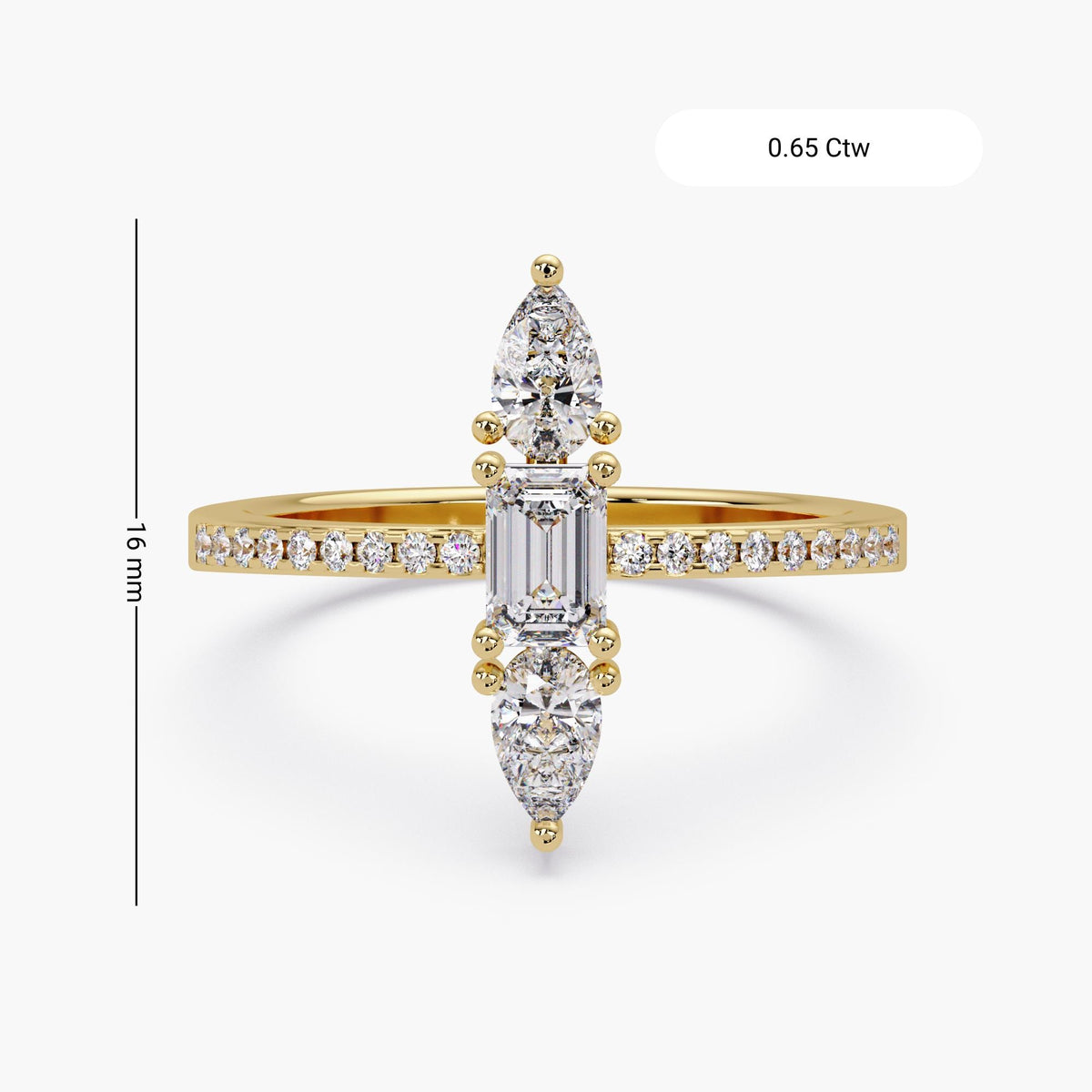 0.65 CTW vertical diamond ring with emerald center and pear accents
