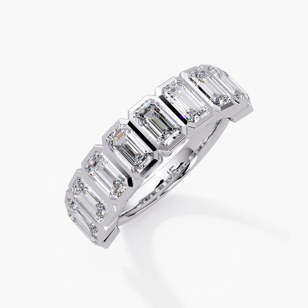 A sculptural emerald-cut diamond band designed to stand out with clean geometry and exceptional sparkle.
This 2.5+ CTW bezel-set half-eternity ring features ten 5×3 mm emerald-cut lab diamonds, each framed in a sleek, modern bezel for secure everyday wear.

Perfect as a wedding band, anniversary band, right-hand ring, or a bold stacking piece.