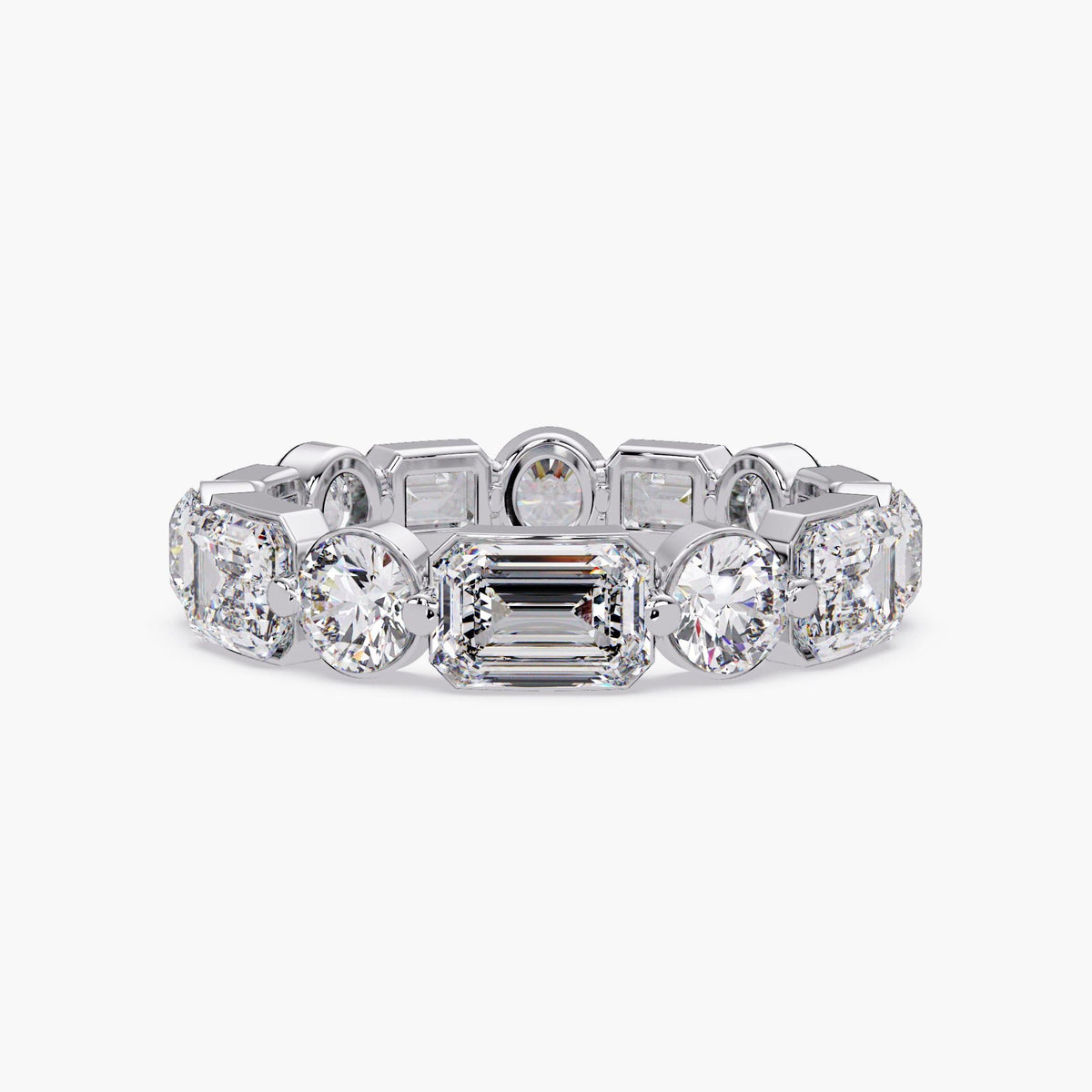 14K white gold tapered eternity band with lab grown emerald and round diamonds