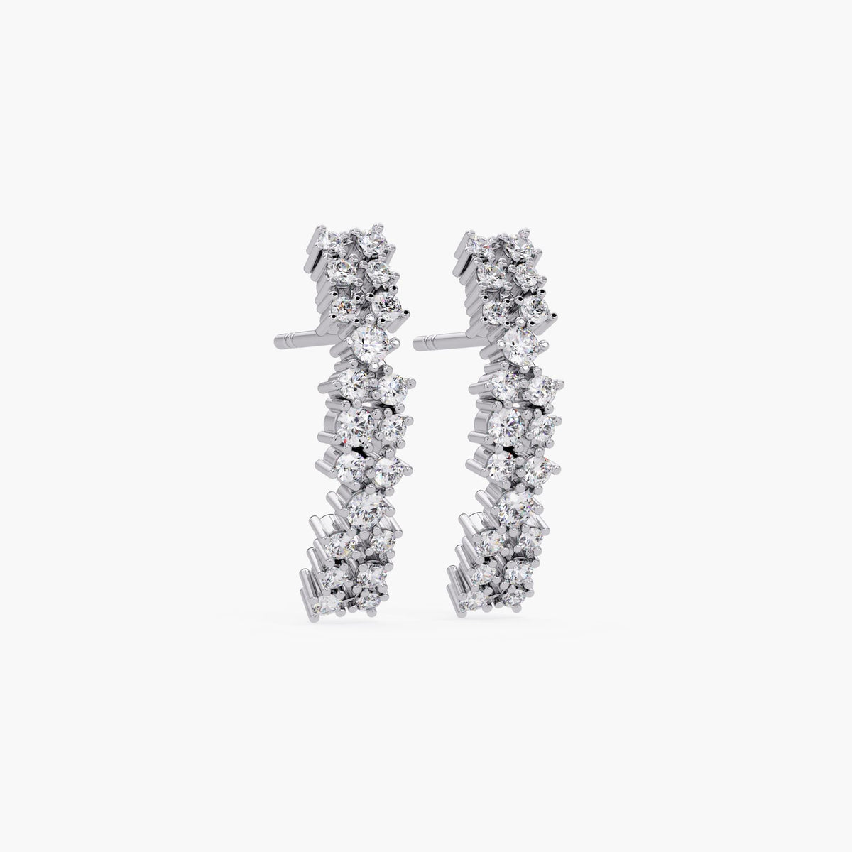 14K white gold diamond half hoop earrings with pushback post and prong-set diamonds.