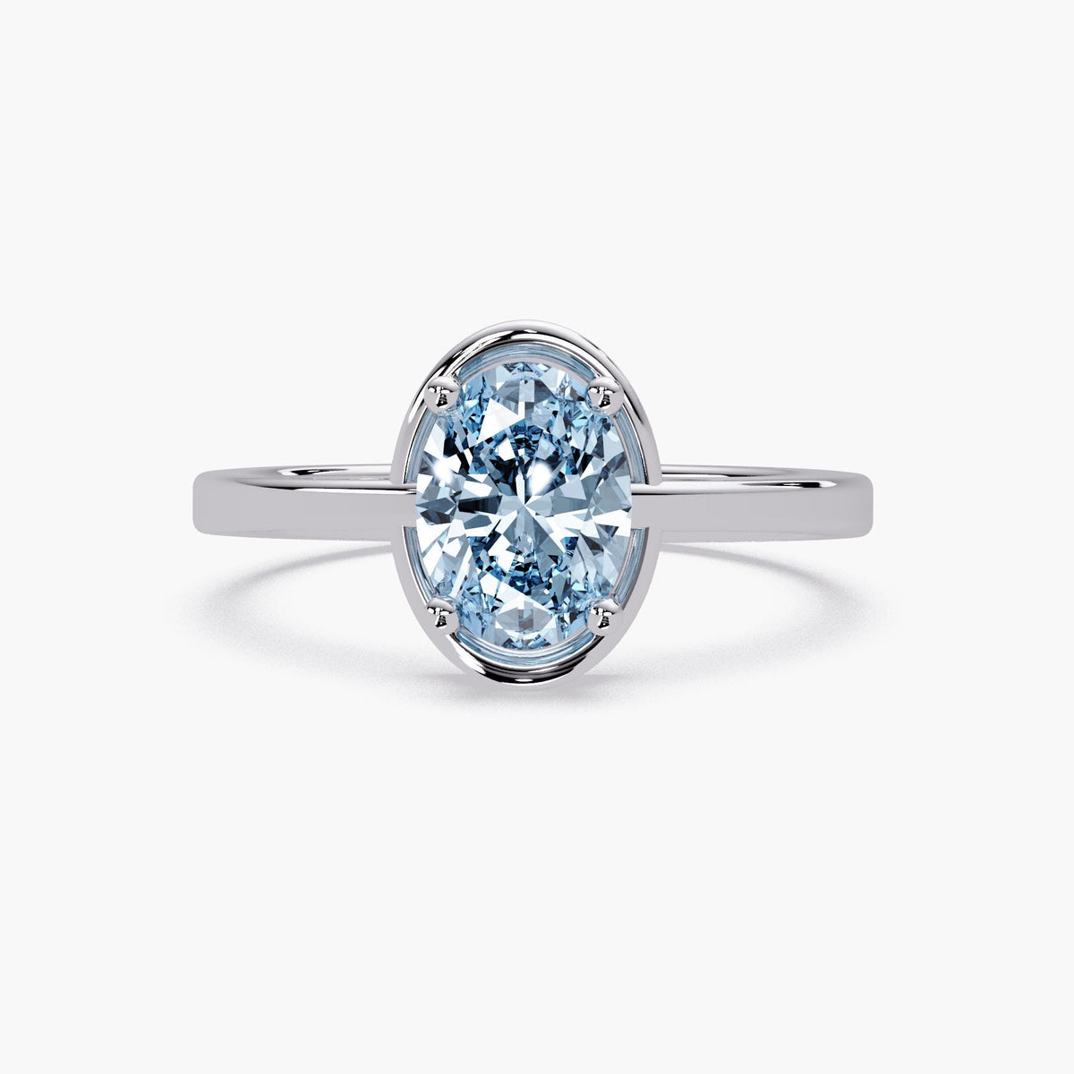 Oval 8x6 mm sky blue topaz ring in 14K white gold with half-bezel and prong setting