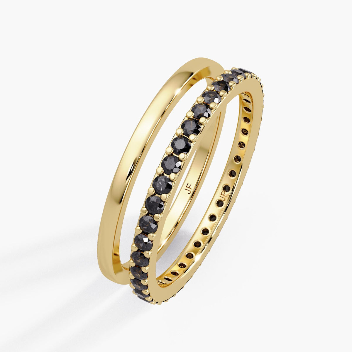 14K yellow gold two-ring stack with detailed dimension callouts. The diamond eternity band is 1.5mm high, set with 1.5mm round diamonds, and the plain band is 1.2mm high. Text indicates the total carat weight is 0.57 CTW for a Size 7 US.