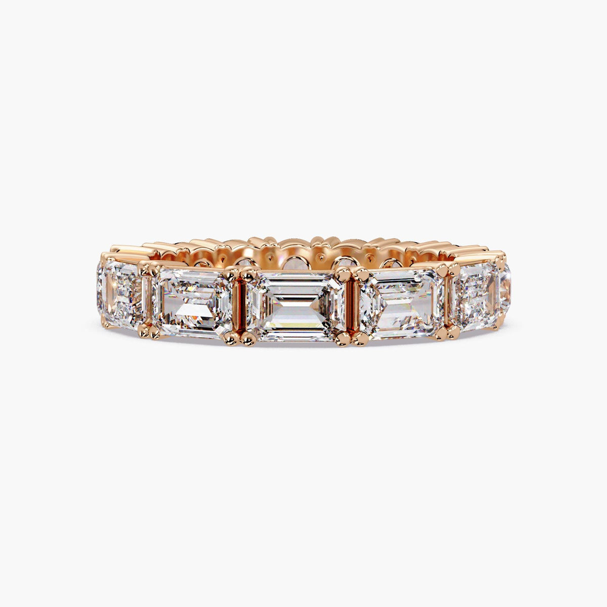 14K rose gold eternity band featuring half emerald-cut and half round lab-grown diamonds in a full-eternity prong setting.
