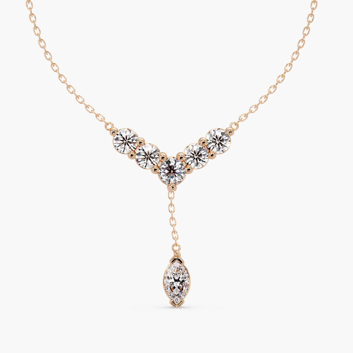 14K rose gold marquise diamond Y lariat necklace shown at the collarbone for scale.