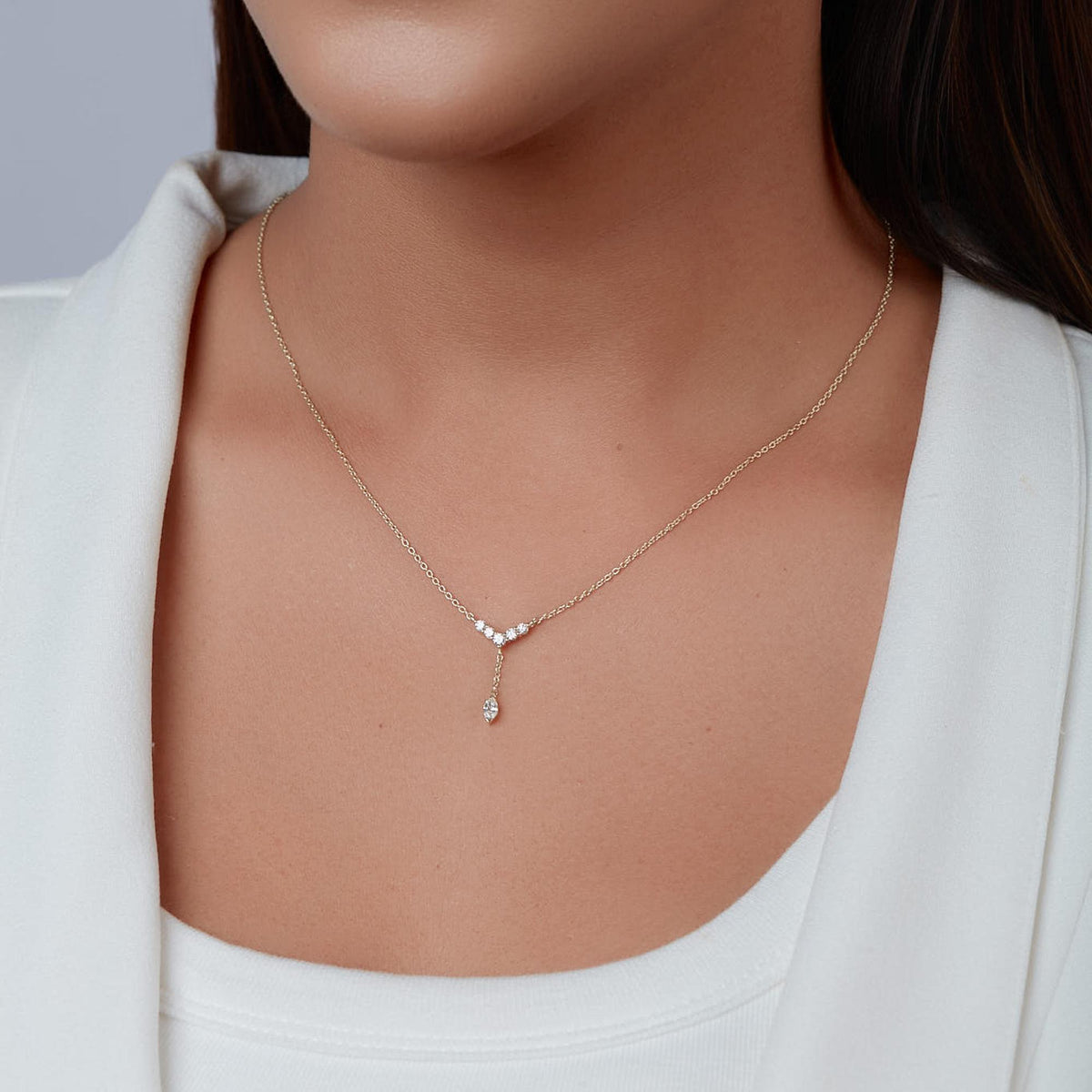 14K gold marquise diamond Y lariat necklace shown at the collarbone for scale.