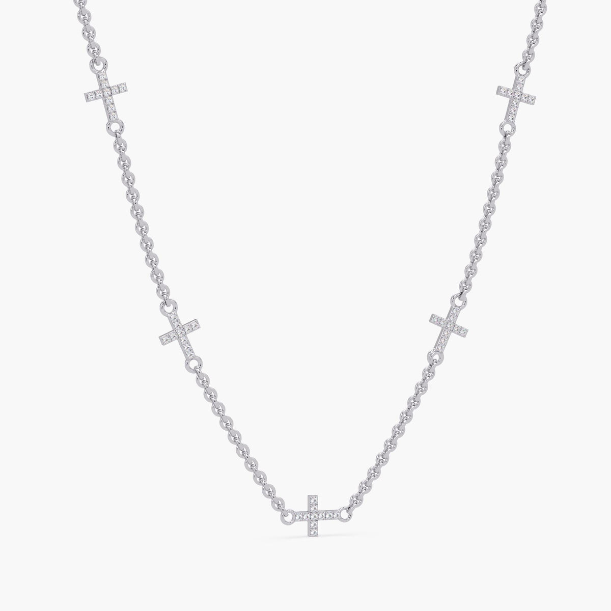 14K white gold diamond sideways cross necklace with five pavé-set natural diamond crosses on a delicate cable chain