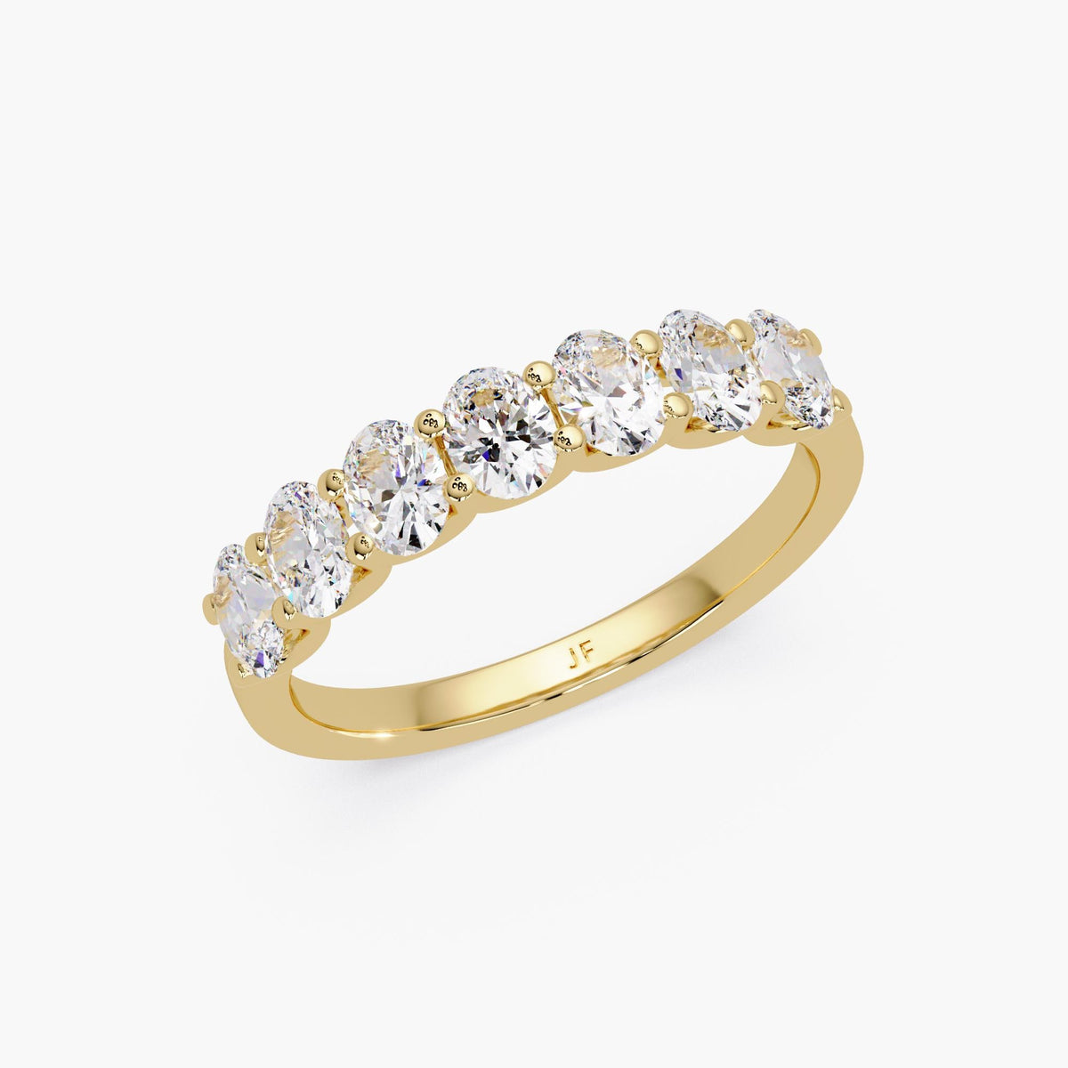 14K yellow gold oval lab grown diamond band with seven prong-set oval diamonds designed for stacking or everyday wear.