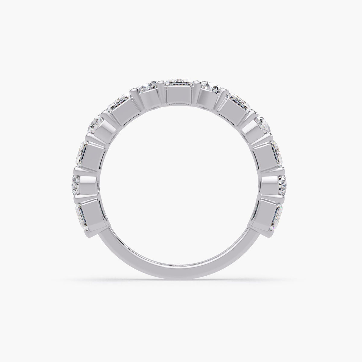 14K white gold eternity band with alternating emerald and pear cut lab grown diamonds set in a prong setting