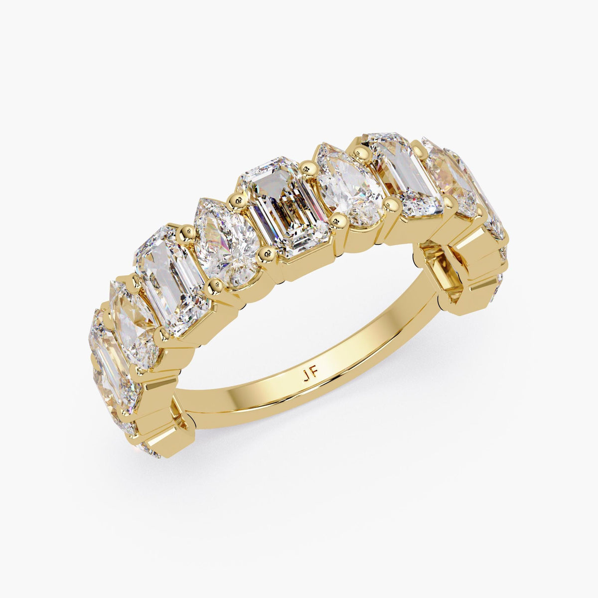 mixed shape emerald and pear cut lab grown diamonds arranged in a wide 14k yellow gold eternity band.