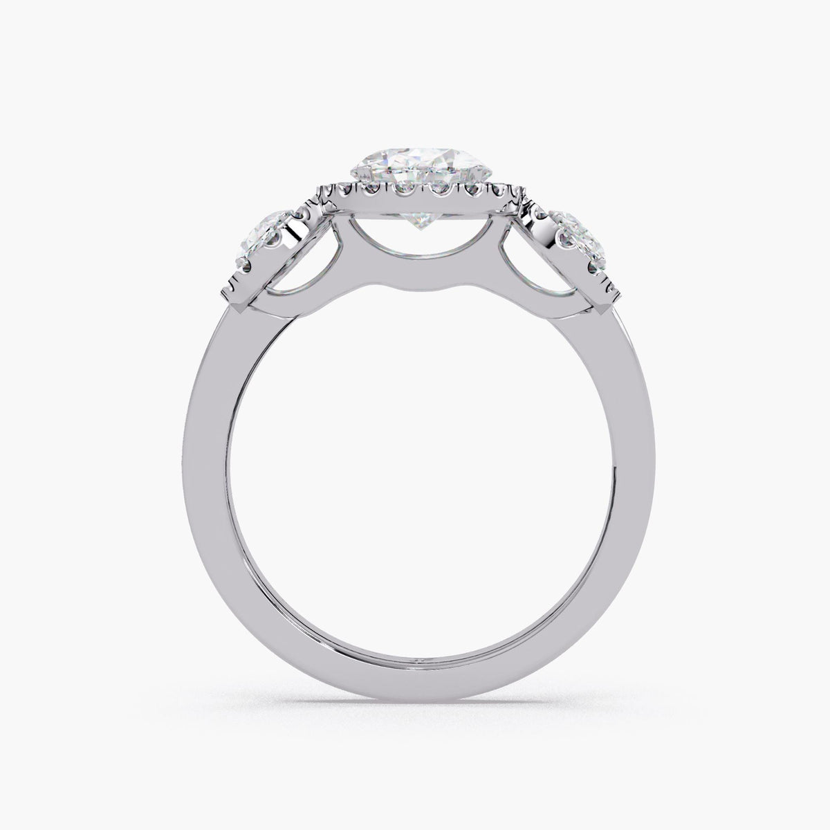 14K white gold oval lab grown diamond 3 stone halo ring showing the raised halo setting, prong set center oval, oval side stones, and smooth solid gold band for engagement or anniversary wear
