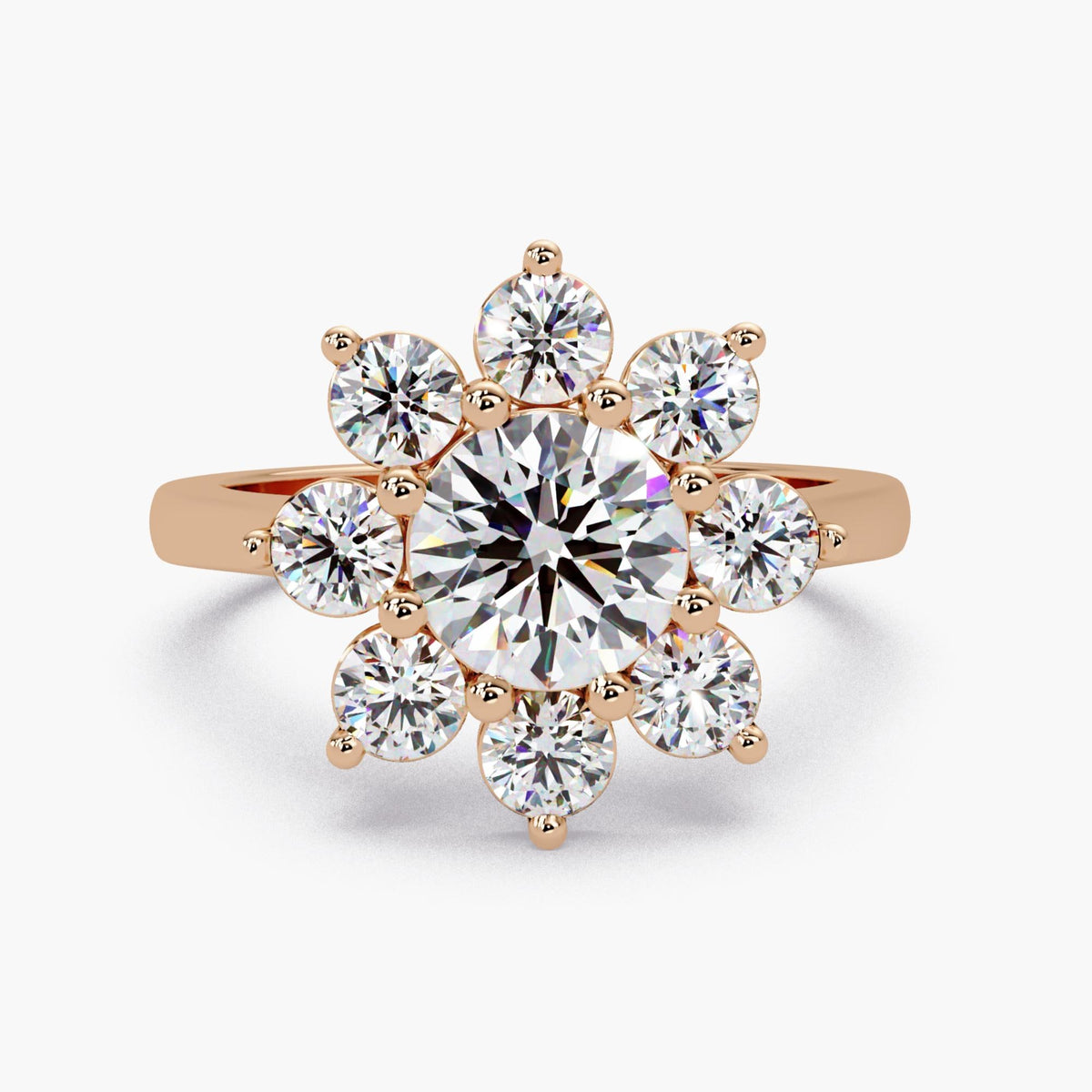 14K rose gold ring, featuring a warm, romantic pink hue that contrasts beautifully with the white lab-grown diamonds. The floral halo design takes on a vintage, feminine charm in this metal choice. It is a unique and heartfelt choice for a romantic proposal or a "push present."