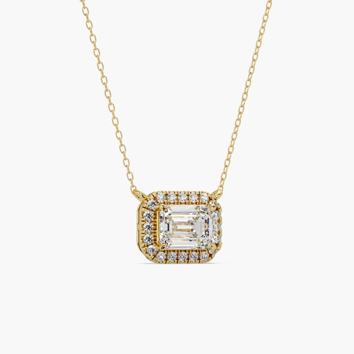 emerald cut lab grown diamond halo pendant necklace in solid 14K yellow gold showing prong set center and diamond halo