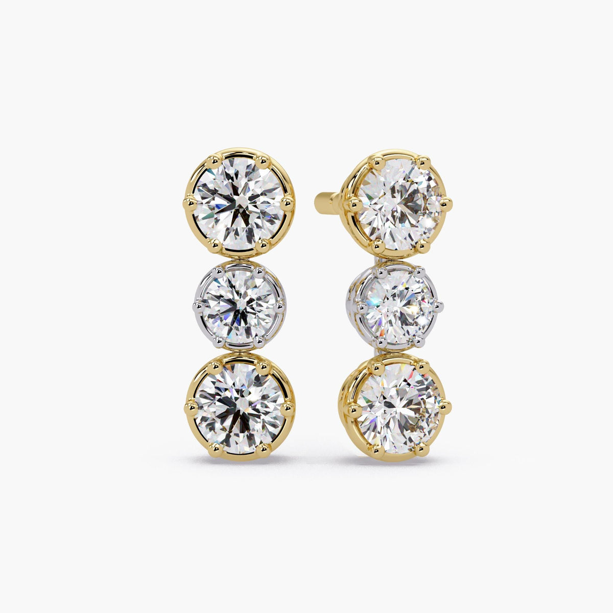 Georgian-inspired mixed metal diamond drop stud earrings with vertical three-stone design, round lab-grown diamonds, and eight-prong crown settings in two-tone gold