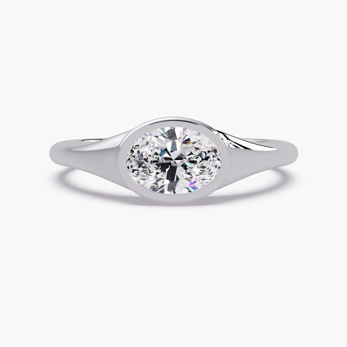 14K white gold bezel set oval lab diamond ring with a smooth tapered band, a minimalist oval solitaire ring for everyday wear, stacking, a promise ring, or a modern engagement ring.