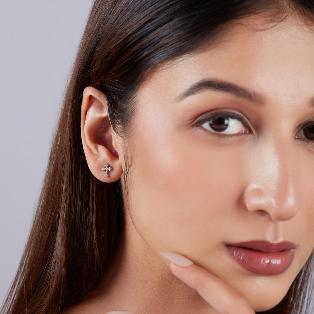small diamond cross earrings worn, minimalist gold cross stud earrings for everyday wear