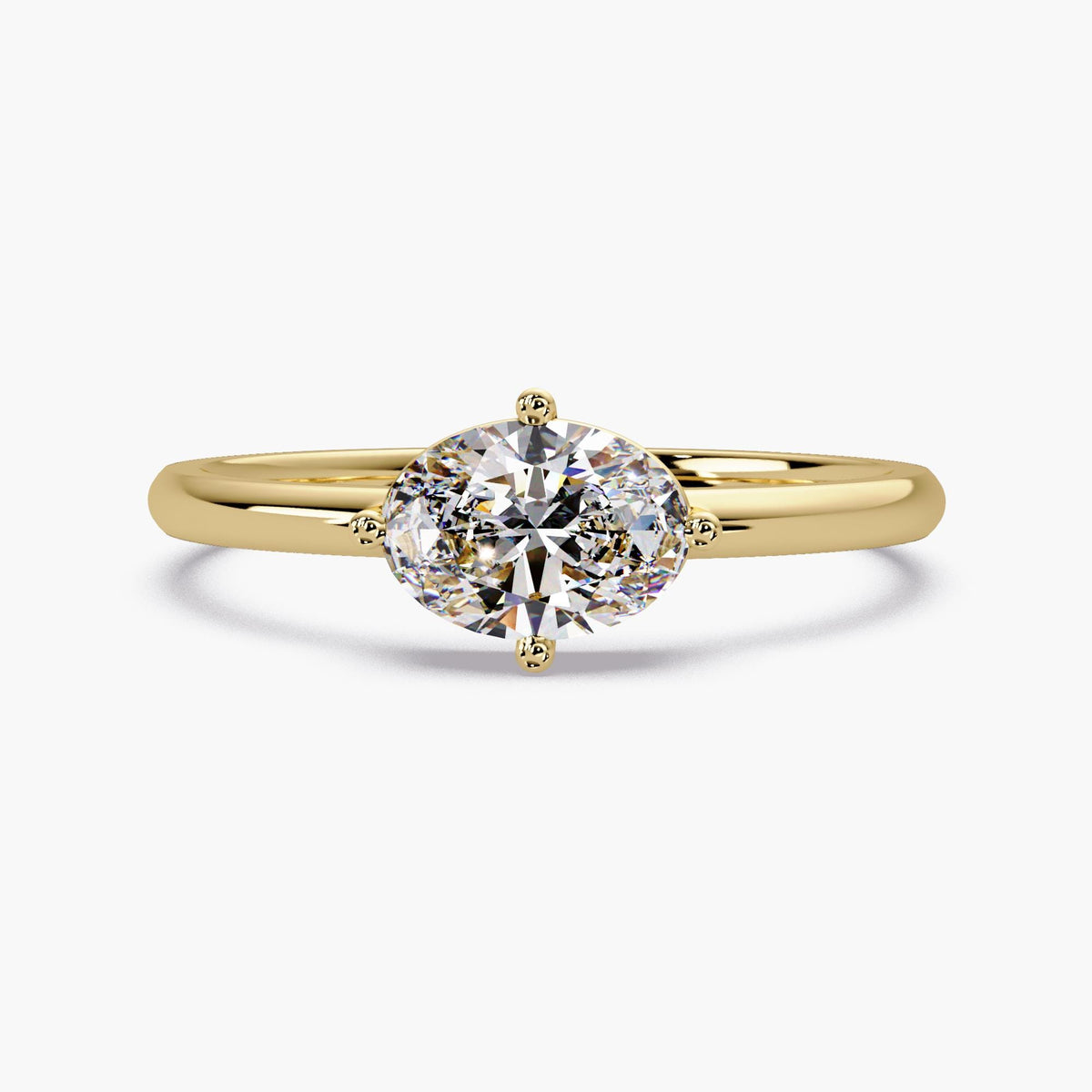 A classic front-facing view of a 14K yellow gold solitaire ring featuring a brilliant 7x5 mm oval lab-grown diamond. This timeless design highlights the stone's elegant silhouette, creating a sophisticated look perfect for a traditional engagement or a meaningful anniversary gift.